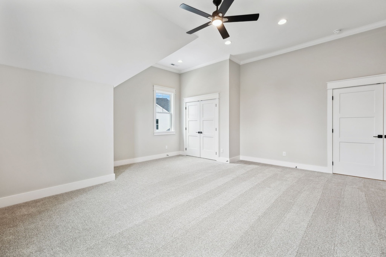 Defatta custom home in Murfreesboro upstairs bedroom with off white walls